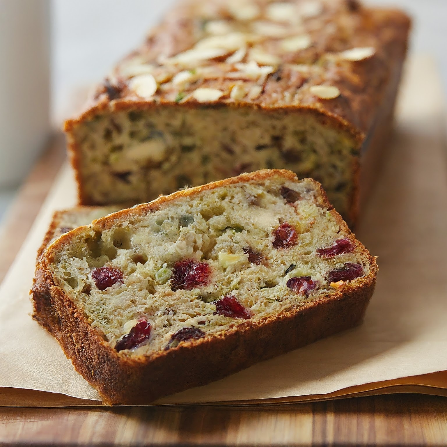 A loaf of zucchini cranberry and walnut bread with almond flour